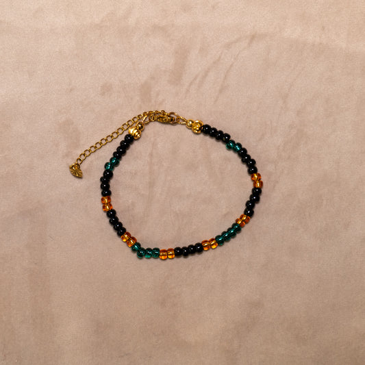 Armband van rocailles in oranje, mat zwart en donkergroen