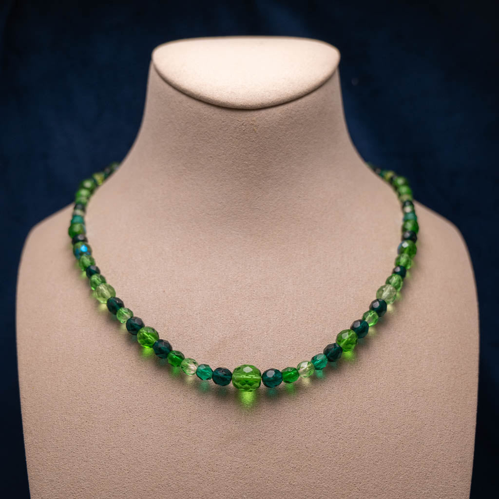 Necklace with green faceted glass beads