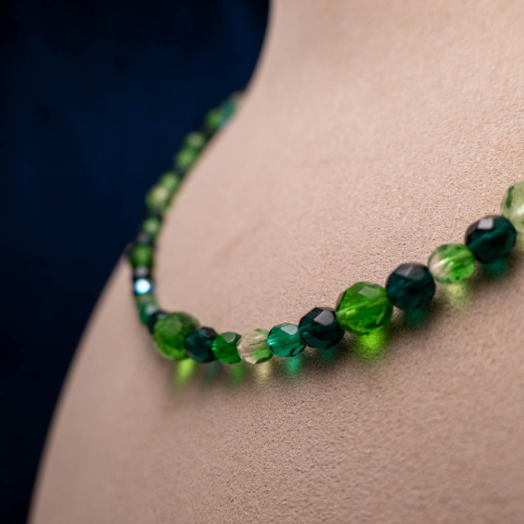 Necklace with green faceted glass beads