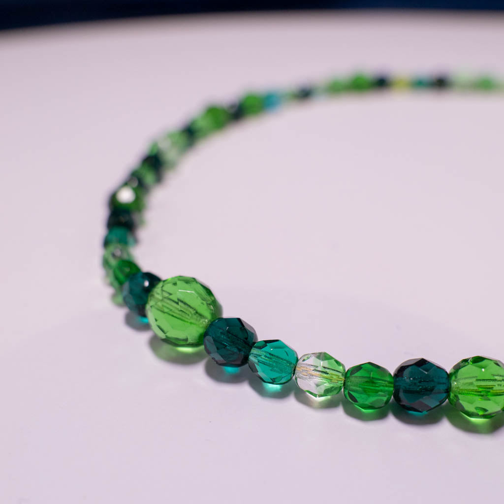 Necklace with green faceted glass beads