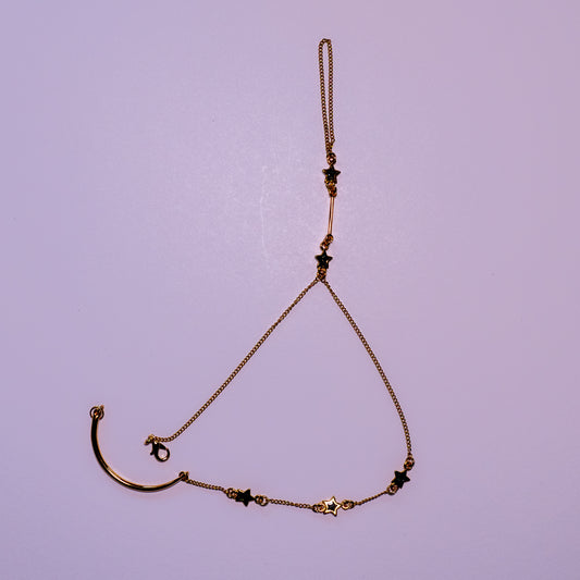 Starlit Path Hand Chain | Gold-Tone Hand Jewelry with Black Stars
